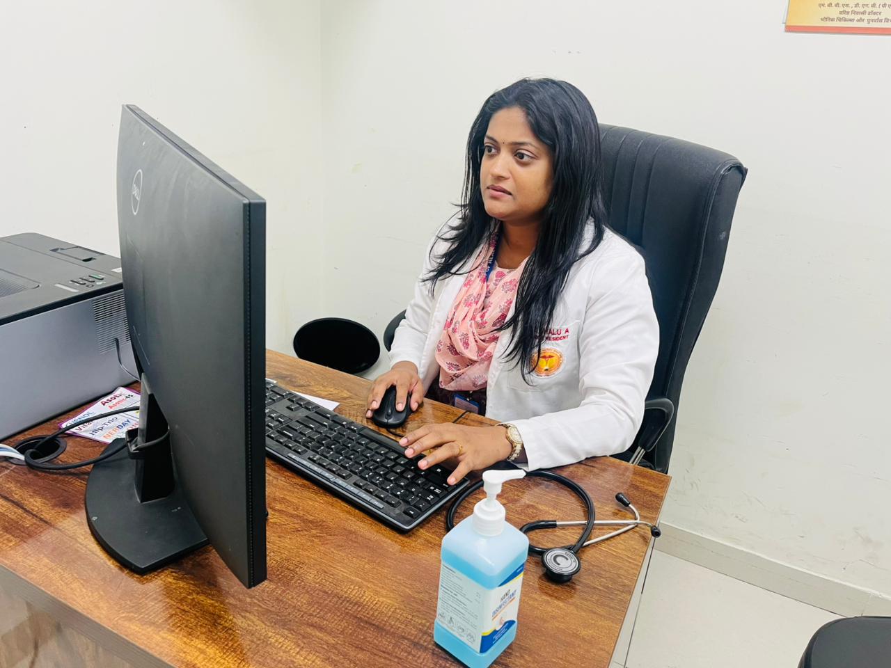 Dr. Shalu at clinic desk — AIIMS Nagpur
